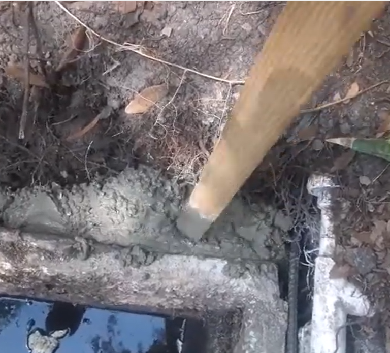 Excavated septic tank during a component repair in Fallbrook